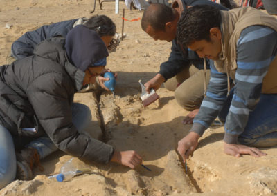 Field school students excavating a Late Period burial