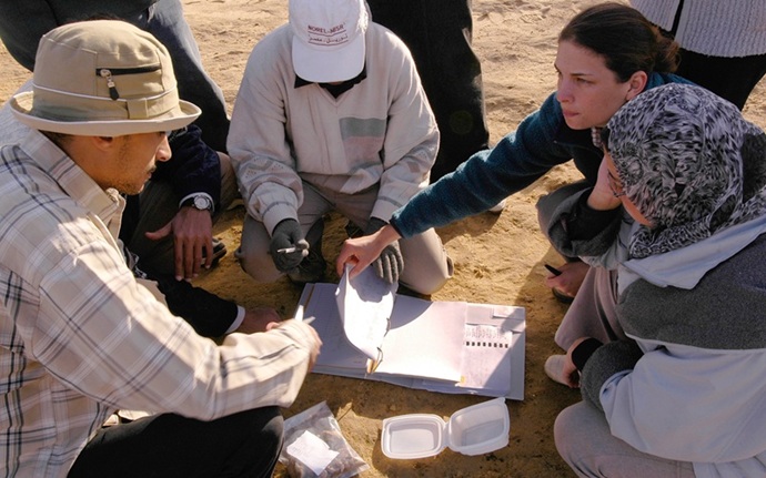 A field school instructor and students in Egypt